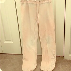 Light pink Calvin Klein sweatpants.